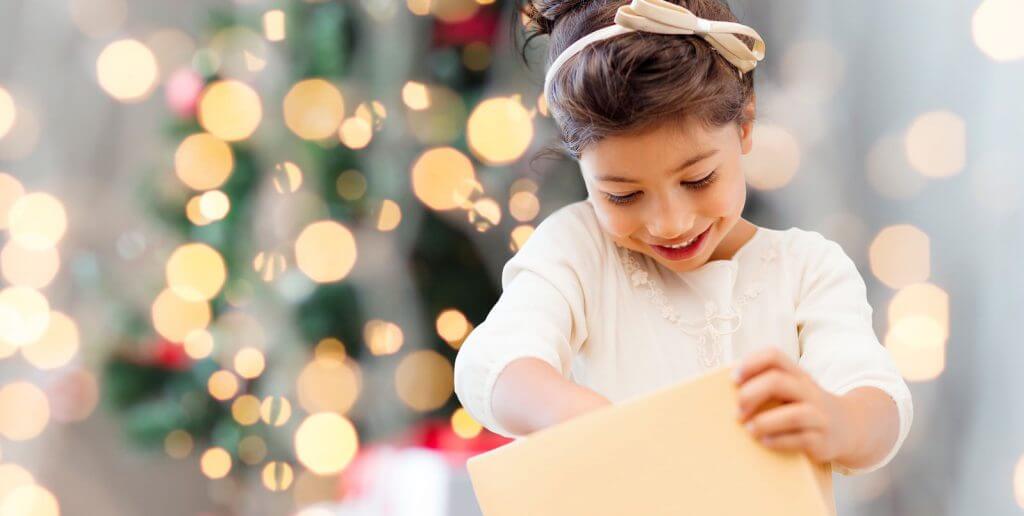 autism-resources-young-girl-opening-present-on-christmas-day