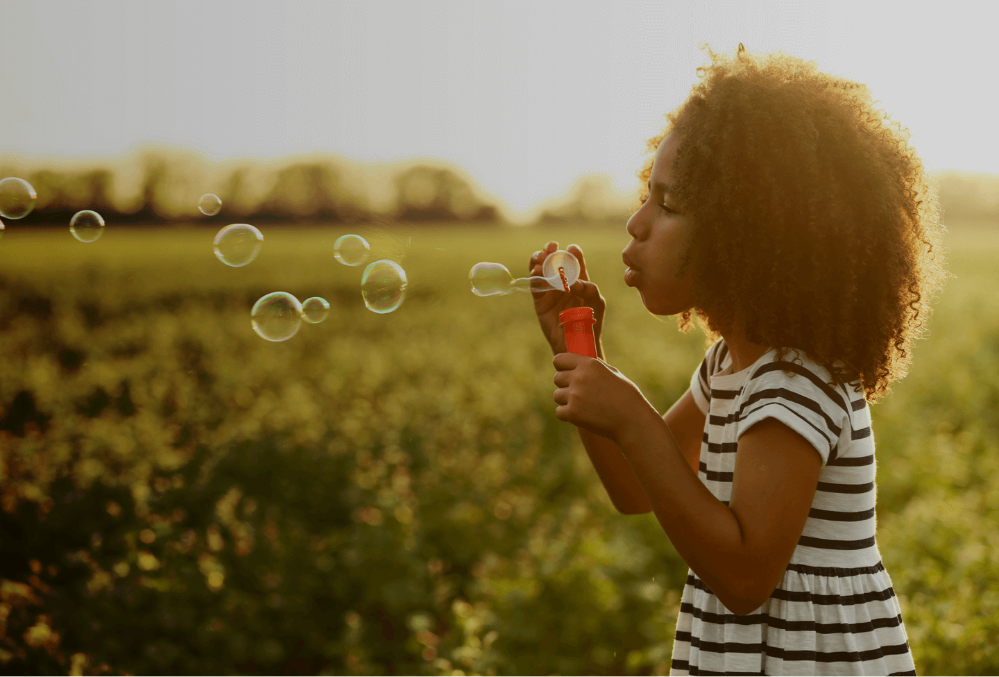 ABA-Therapy-young-girl-blowing-bubbles