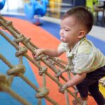 toddler playing at sensory friendly play gym
