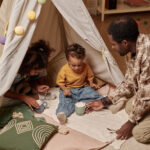 dad and kids playing with hot chocolate