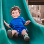 boy sliding down slide